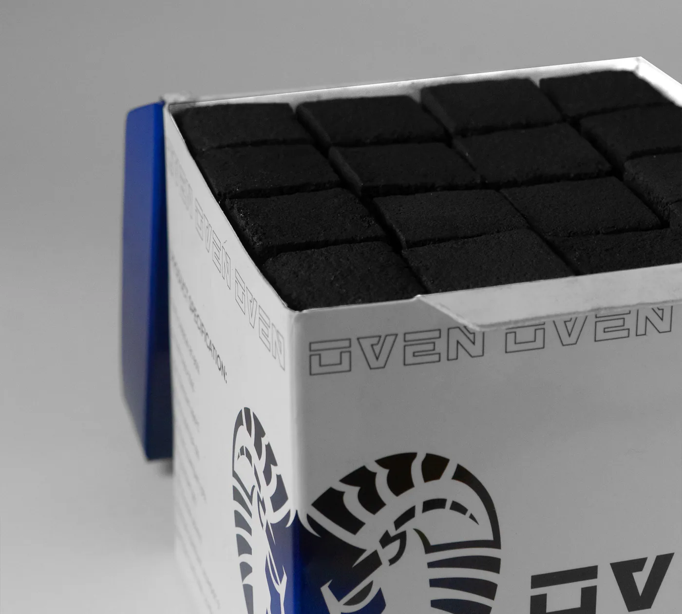 An open OVEN 26 mm box with the cubes packed in an even grid